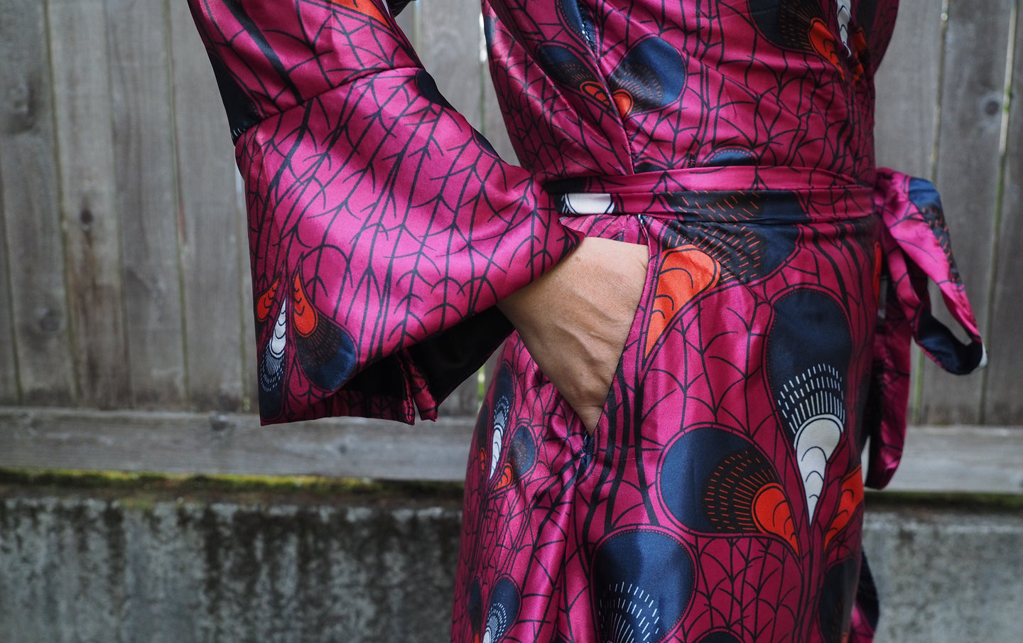 Closefup of a pocket on the hip if a pink silk dress