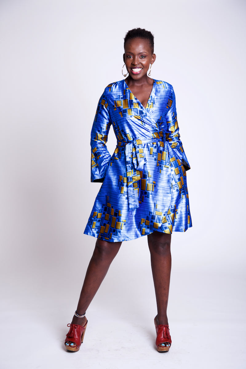 Wrap-dress done in a sapphire blue silk with gold accents